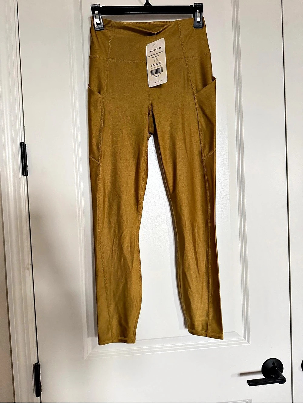 Fabletics Oasis Shine High-Waisted Pocket 7/8 Shiny Pocket Leggings in Brown
